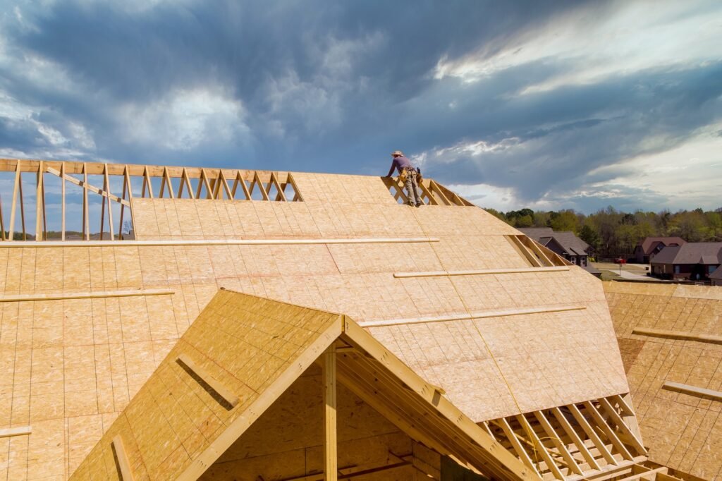 Home roof construction site working on the roof sheeting